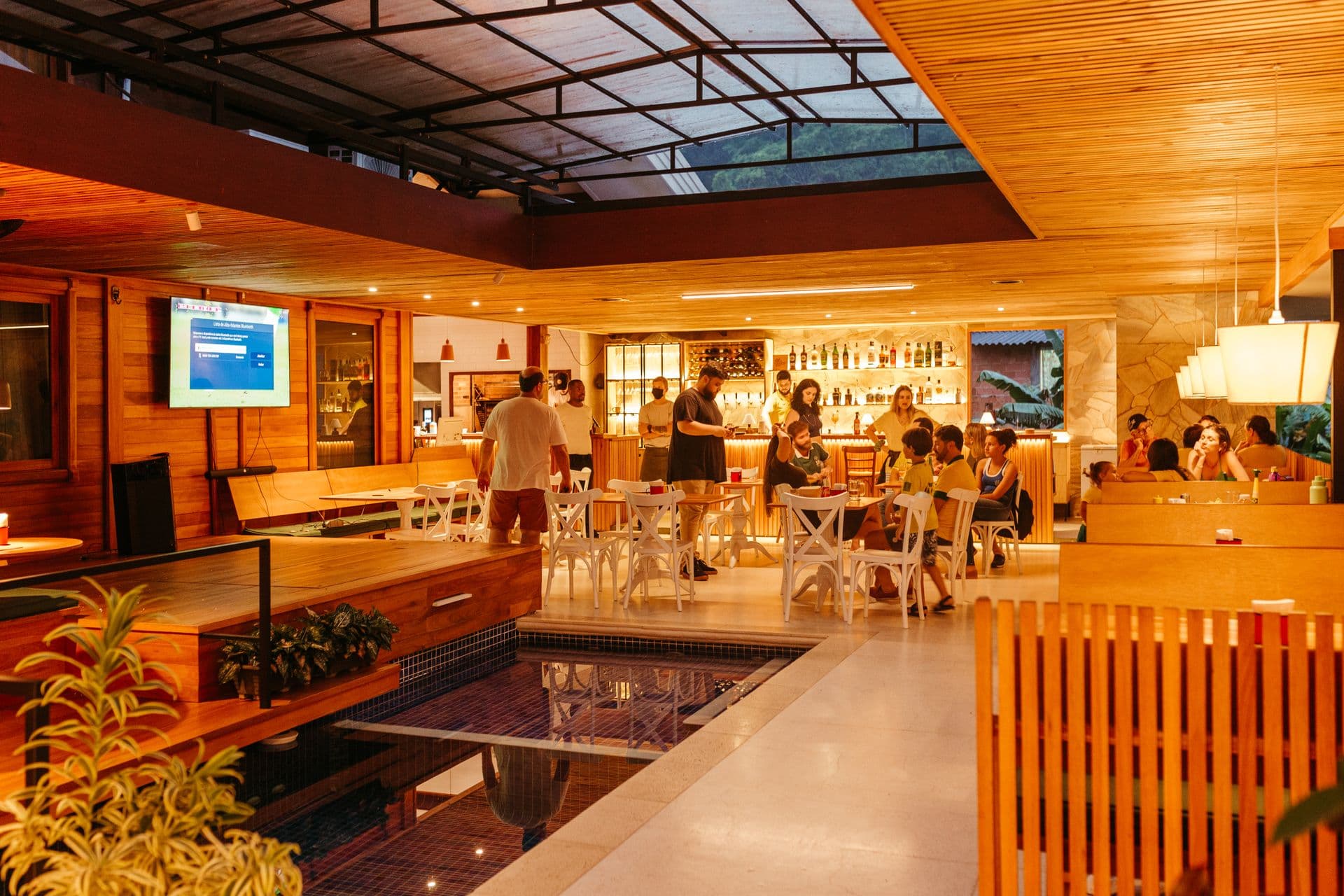 Restaurant interior with tables, chairs, and a bar area
